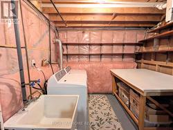 Laundry & Storage Area with workbench - 