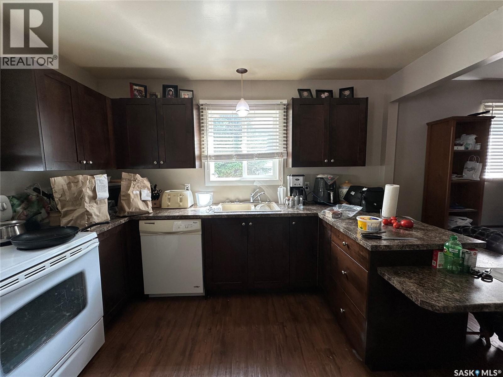 242 Third Avenue N, Kamsack, SK - Indoor Photo Showing Kitchen With Double Sink