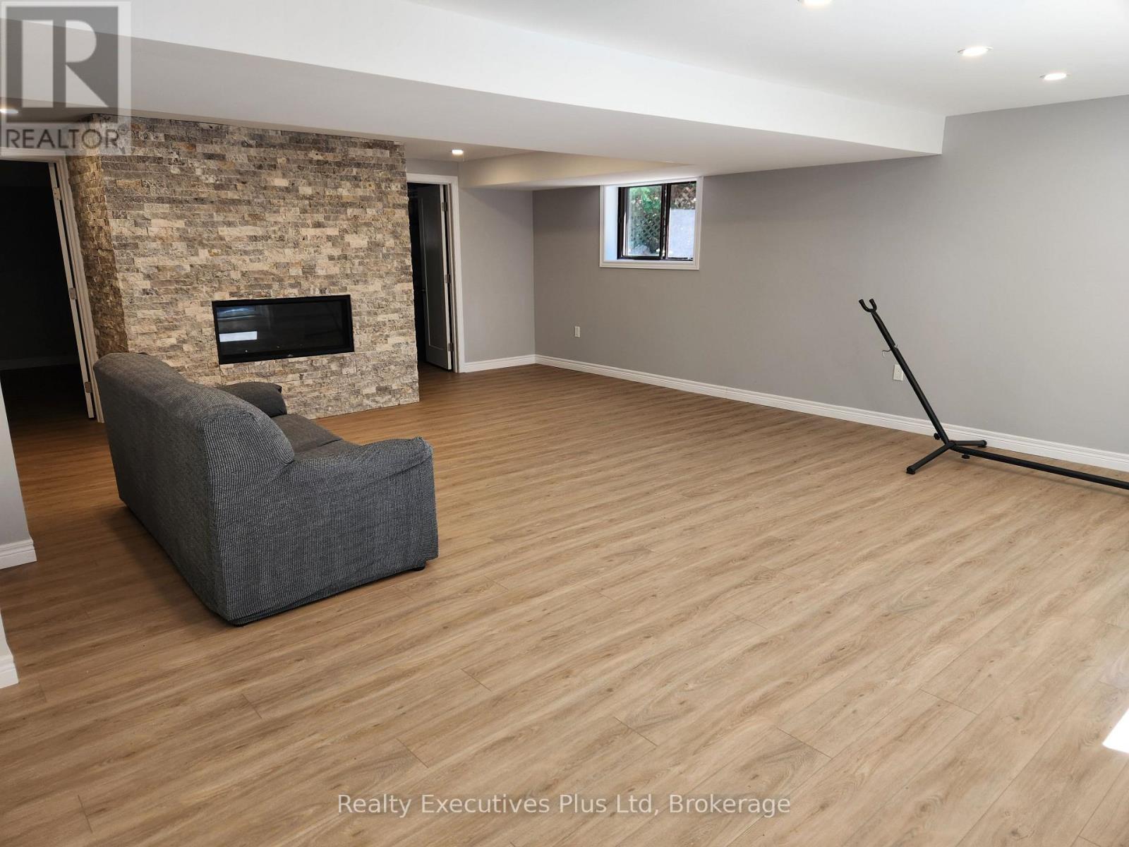 Family Room with Gas FP - 2 Zelia Court, Tiny, ON - Indoor With Fireplace