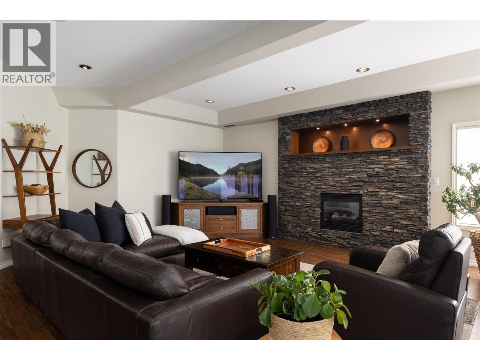 10 Bayview Heights, Coldstream, BC - Indoor Photo Showing Living Room With Fireplace