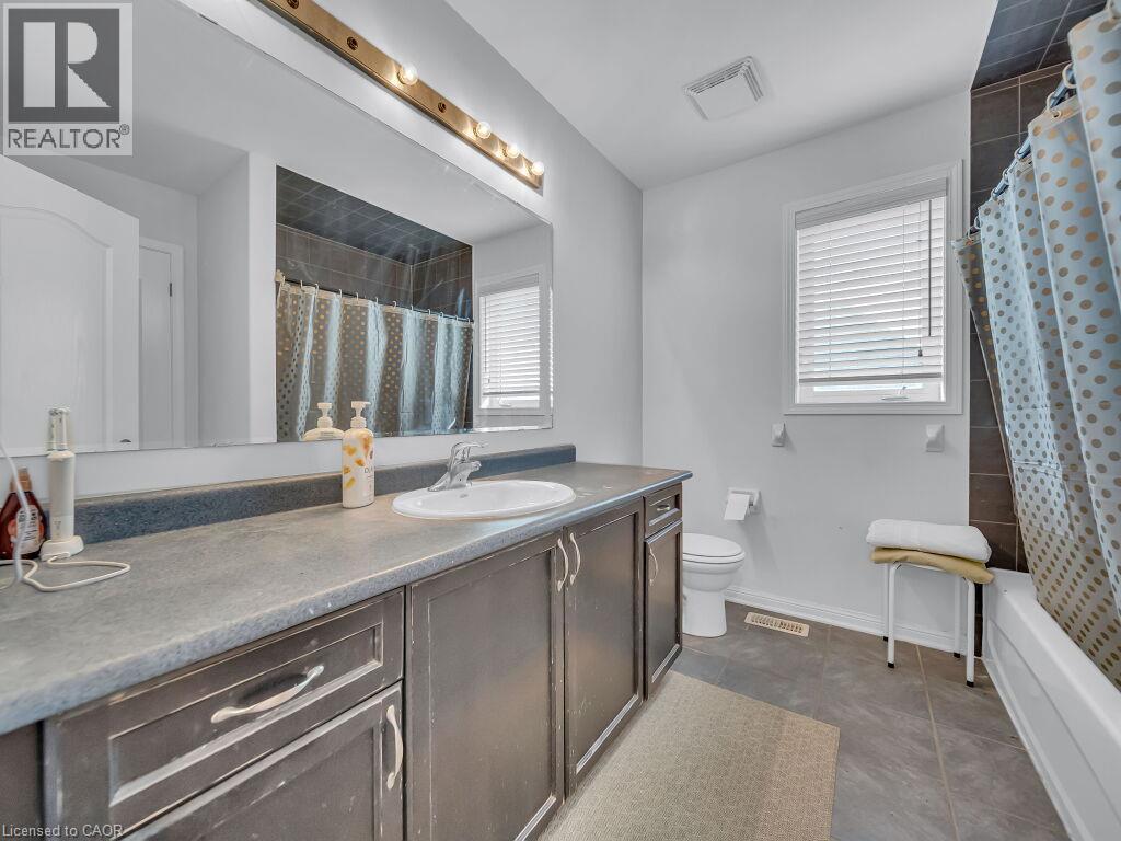 Vanity with an integrated sink and laminate countertop - 227 Baldwin Drive Unit# Main, Cambridge, ON - Indoor Photo Showing Bathroom