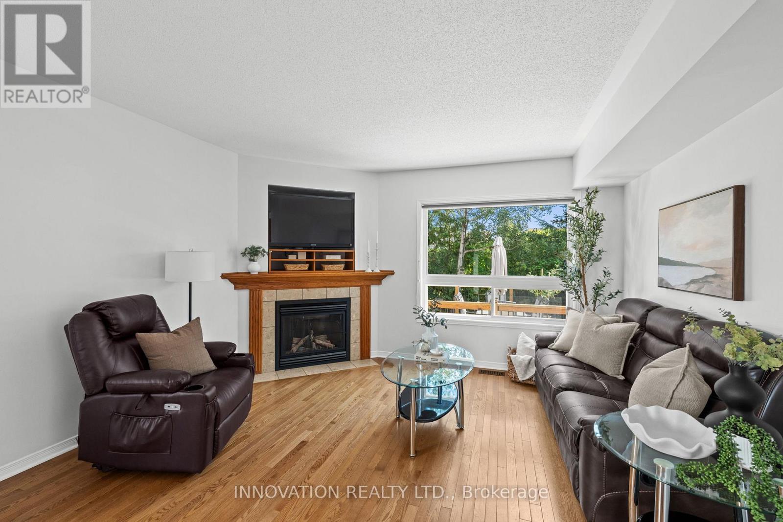 37 Chantilly Gate, Ottawa, ON - Indoor Photo Showing Living Room With Fireplace