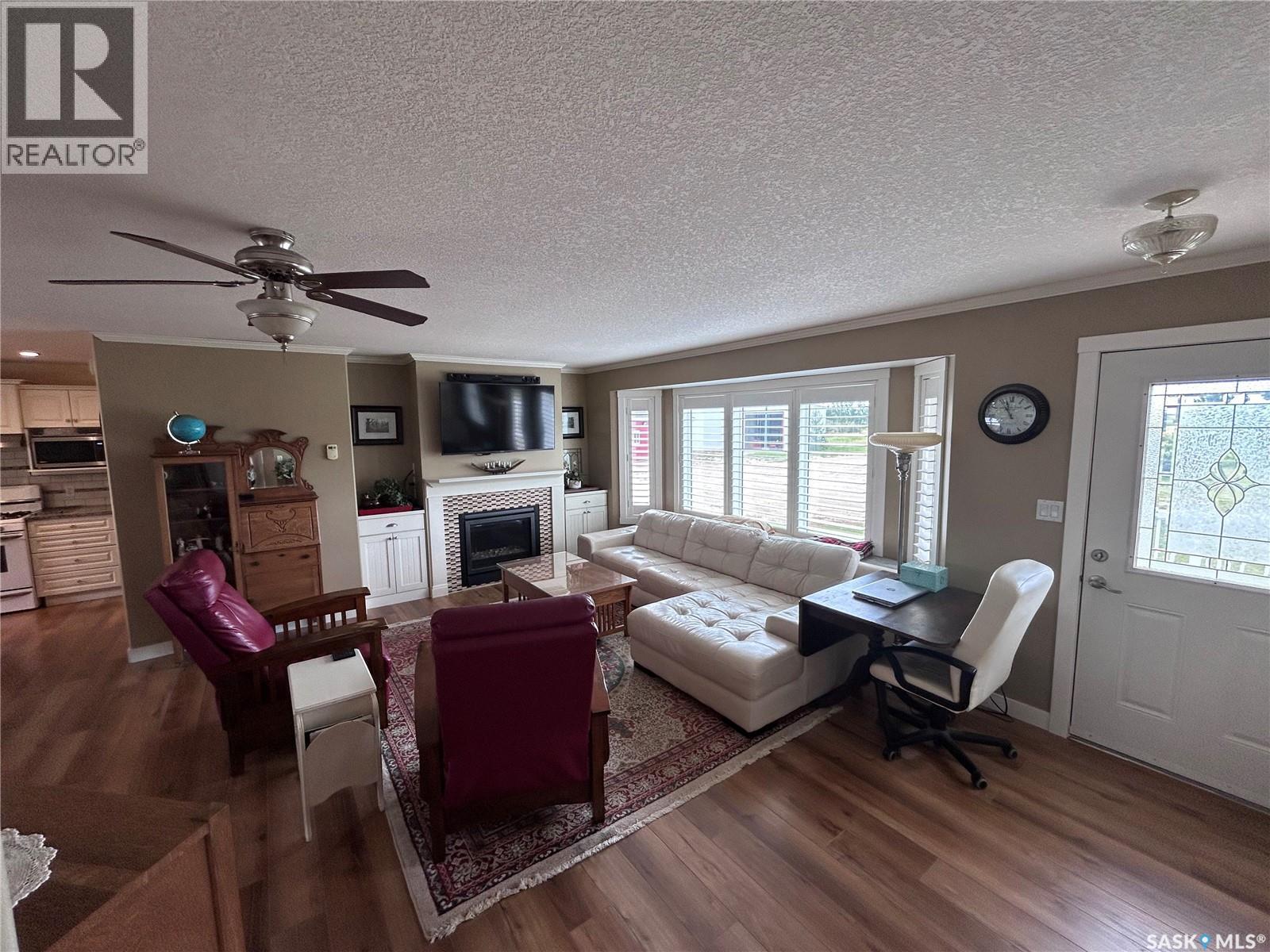 Dew Acreage, Estevan Rm No. 5, SK - Indoor Photo Showing Living Room With Fireplace