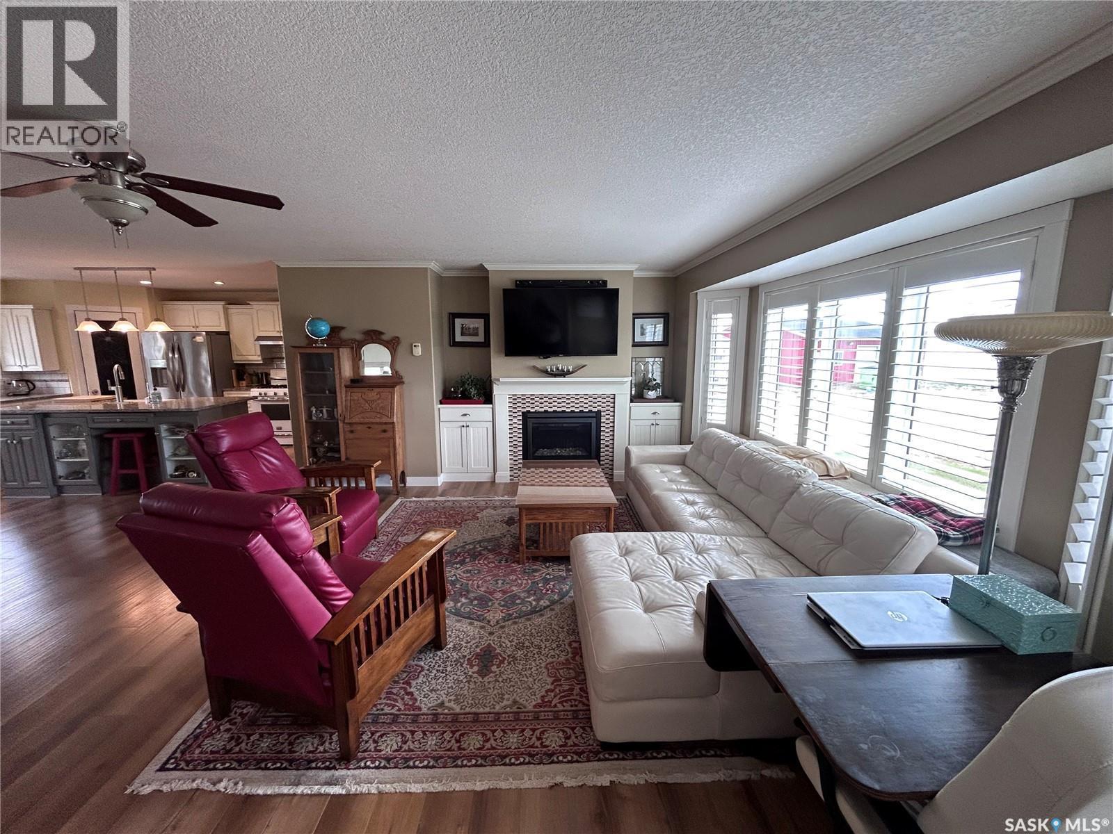 Dew Acreage, Estevan Rm No. 5, SK - Indoor Photo Showing Living Room With Fireplace