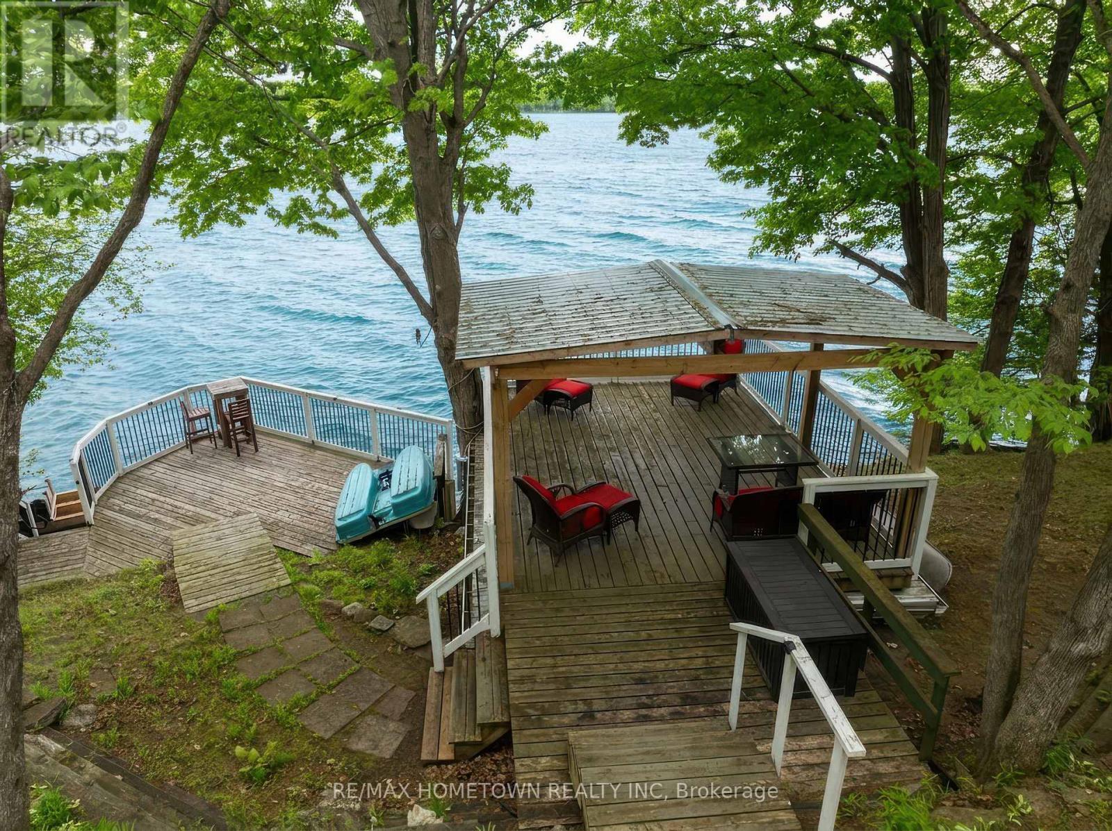 Plenty of waterfront space to entertain! - 66 Scott Lane, Rideau Lakes, ON - Outdoor With Body Of Water