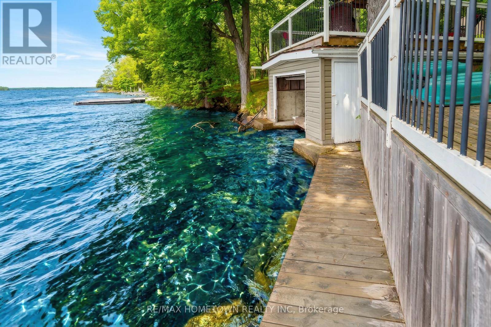 Side dock, leading to boathouse entry - 66 Scott Lane, Rideau Lakes, ON - Outdoor With Body Of Water