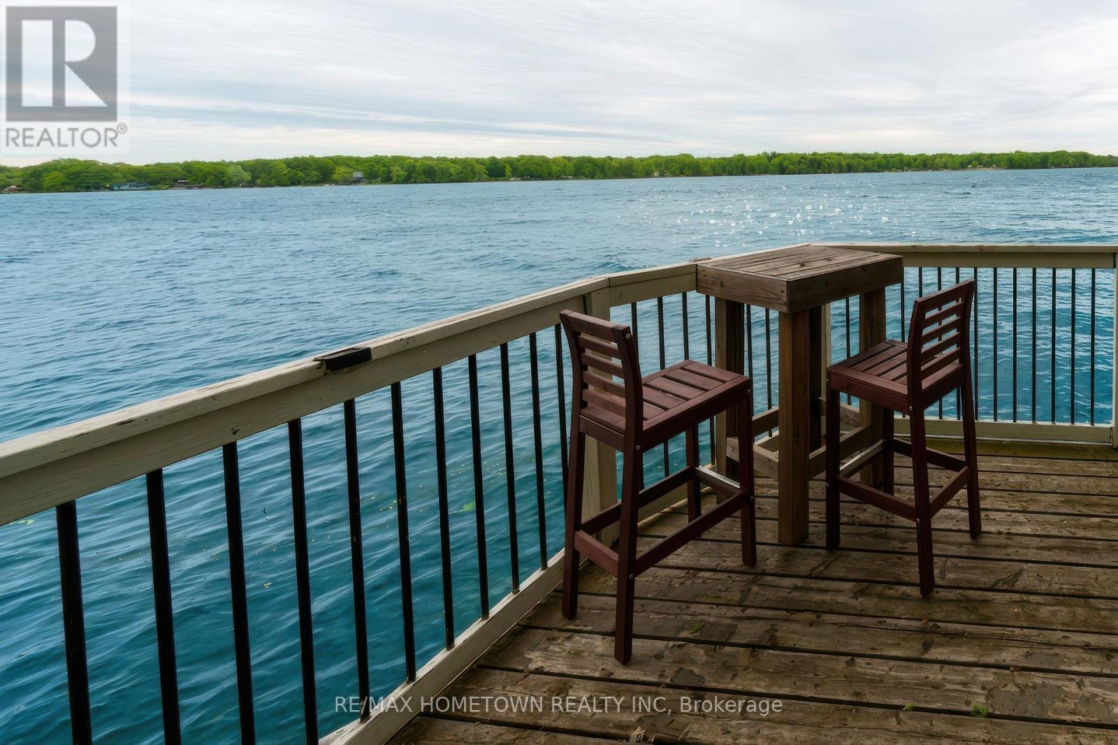 Second tier lower deck view, time to sit a spell! - 66 Scott Lane, Rideau Lakes, ON - Outdoor With Body Of Water With View