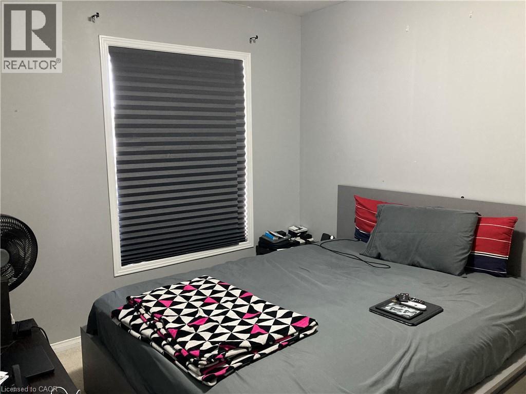 Window with white trim and horizontal blinds - 720 Brookmill Place, Waterloo, ON - Indoor Photo Showing Bedroom