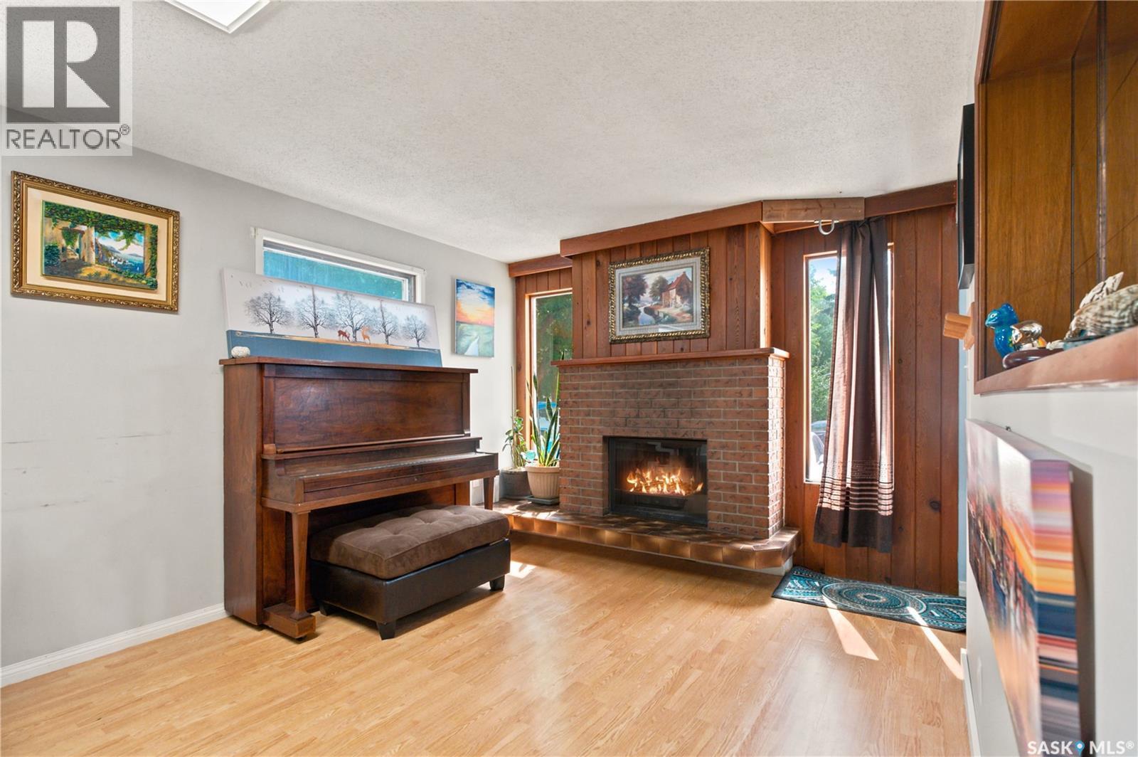 310 Douglas Crescent, Saskatoon, SK - Indoor Photo Showing Living Room With Fireplace