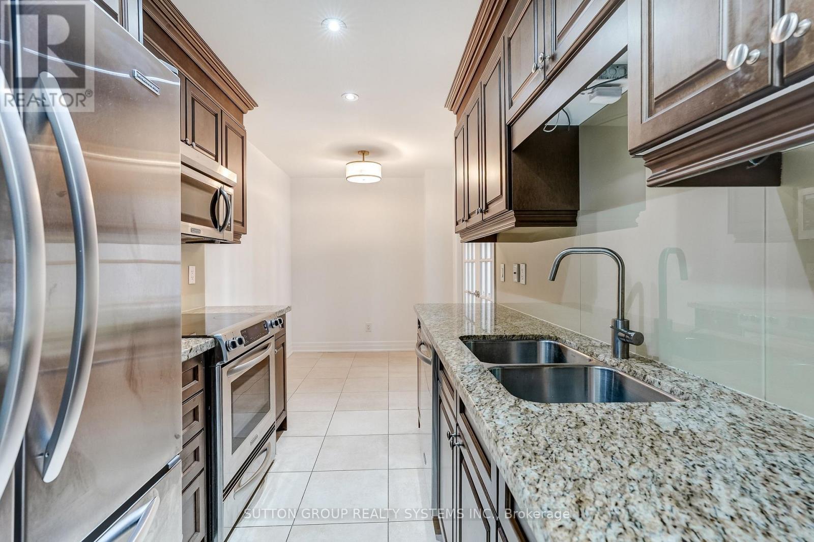 408 - 15 Rean Drive, Toronto, ON - Indoor Photo Showing Kitchen With Double Sink With Upgraded Kitchen