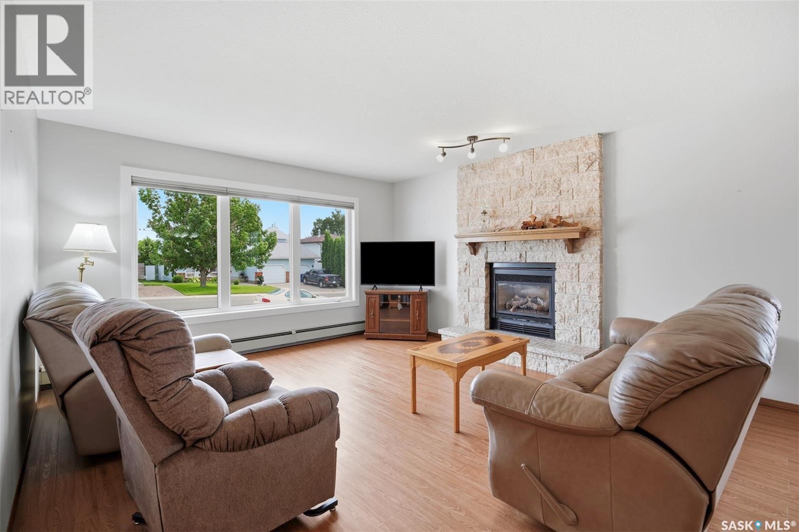 139 Wright Crescent, Biggar, SK - Indoor Photo Showing Living Room With Fireplace