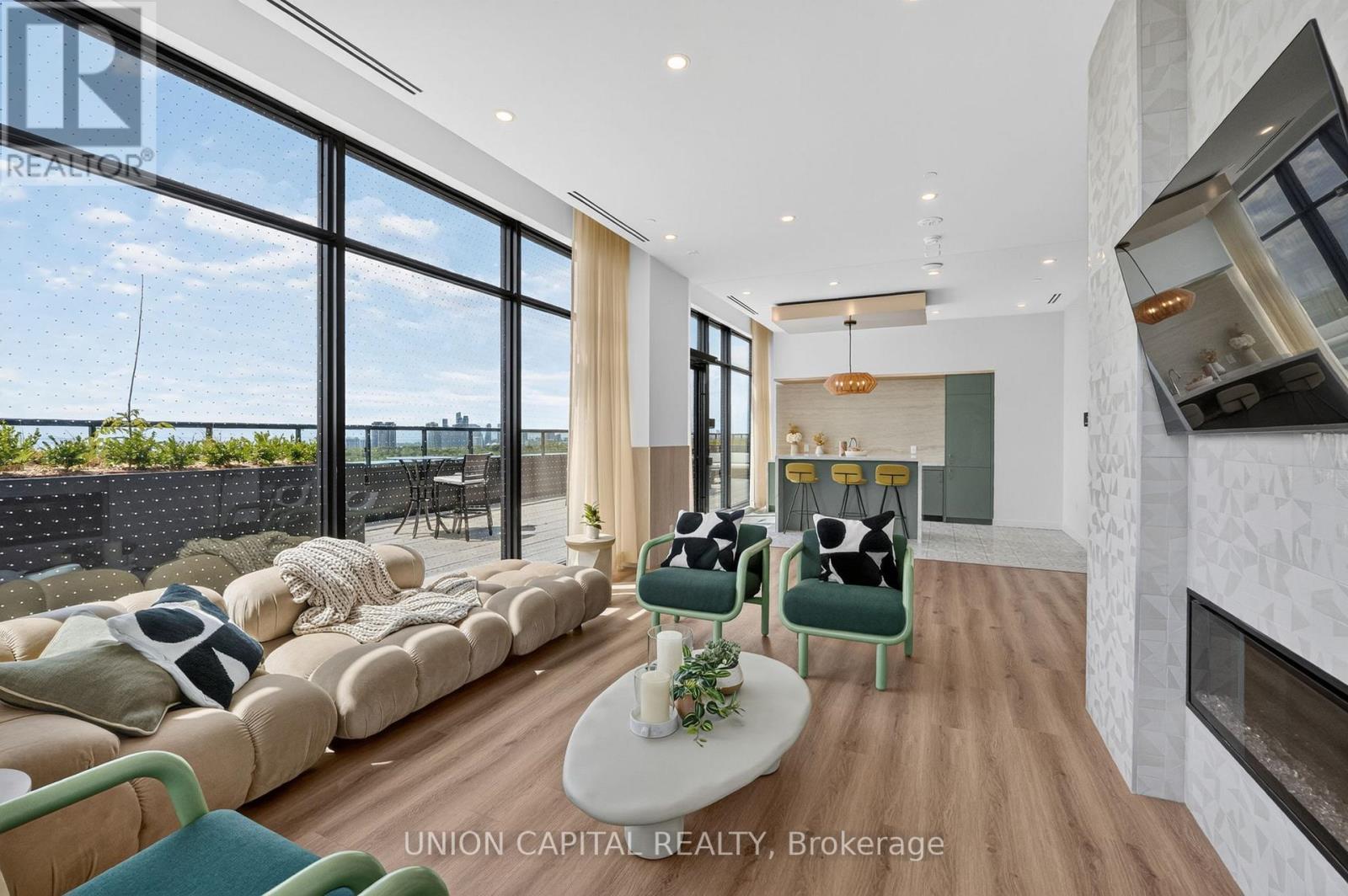 910 - 1660 Bloor Street W, Toronto, ON - Indoor Photo Showing Living Room With Fireplace