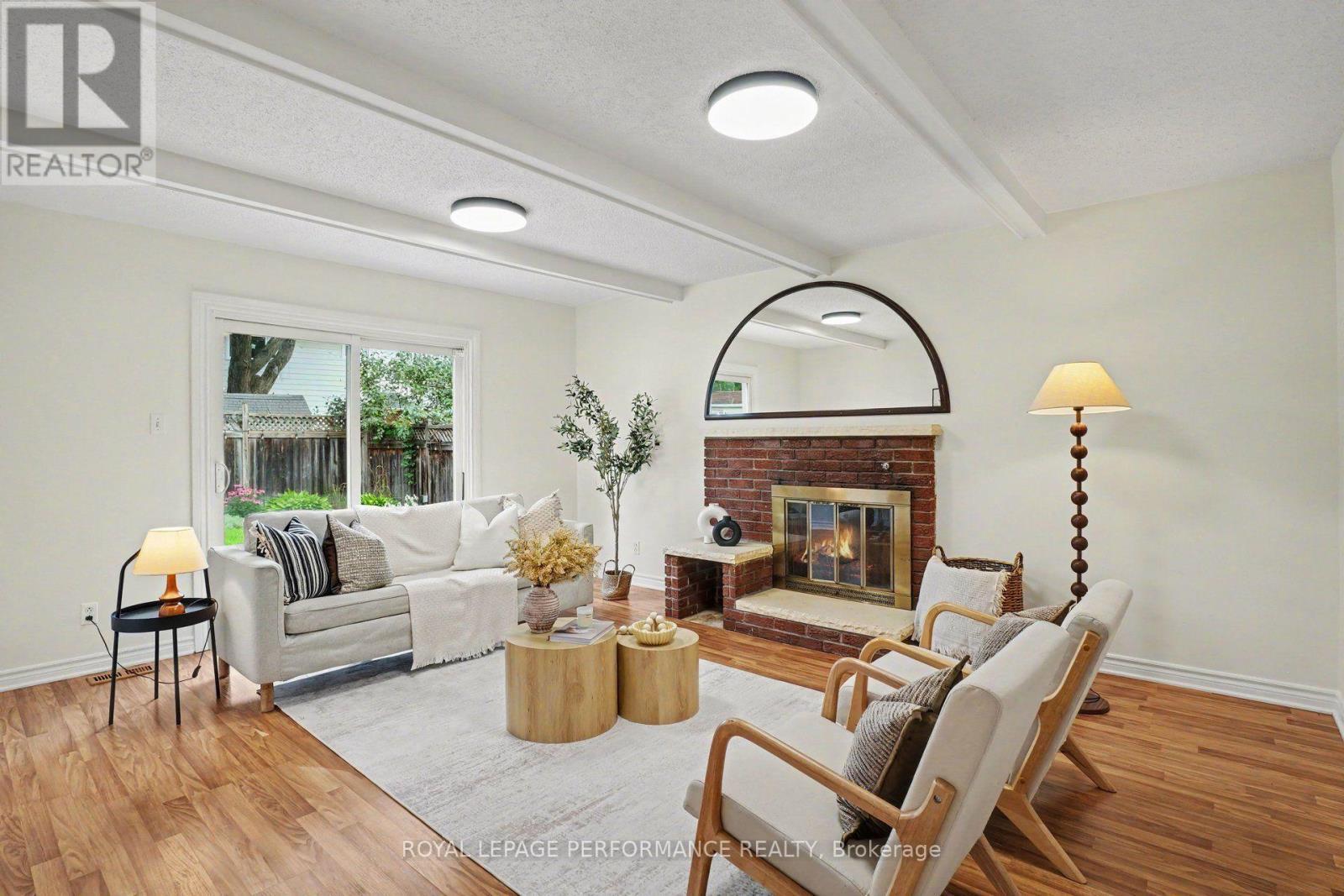 13 Centrepark Drive, Ottawa, ON - Indoor Photo Showing Living Room With Fireplace
