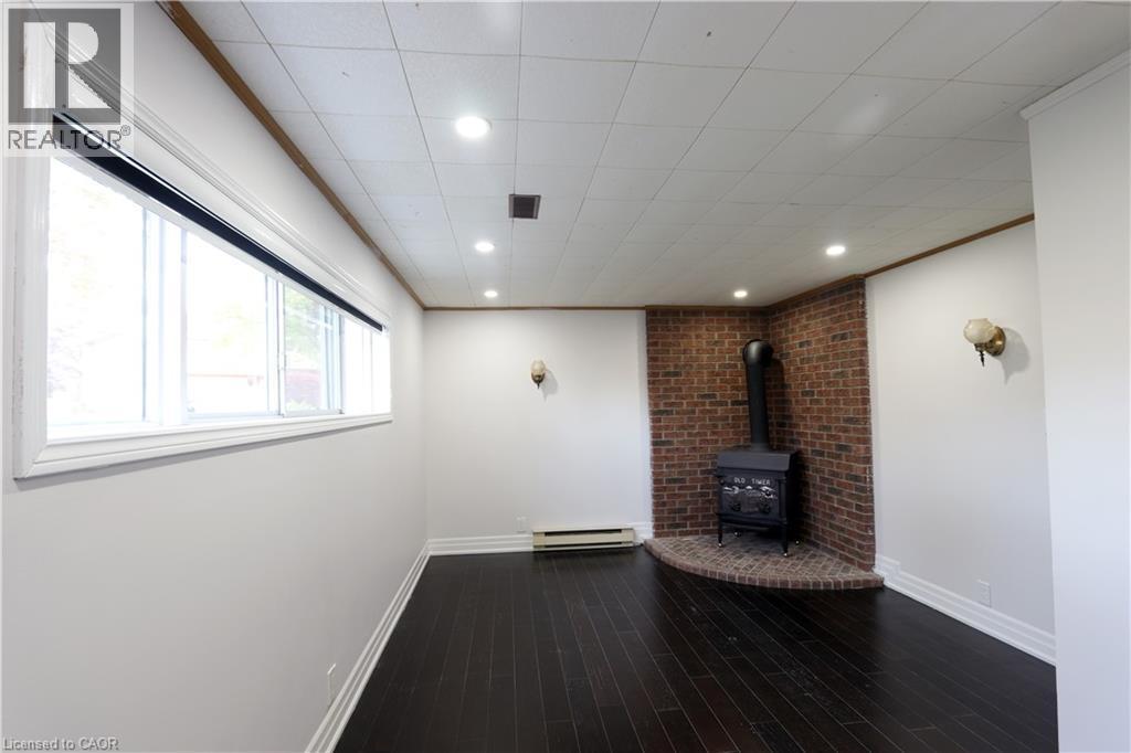 77 Orchard Mill Crescent, Kitchener, ON - Indoor Photo Showing Other Room With Fireplace
