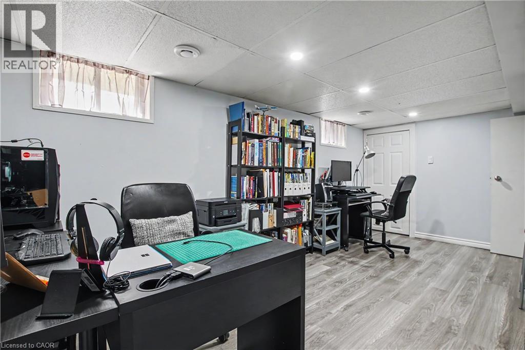 Recessed lighting illuminates the space, featuring wood-finish flooring, drop ceiling, and light-toned wall paint - 16 Mercer Road, Cambridge, ON - Indoor Photo Showing Office
