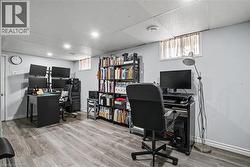 Expansive flexible space featuring wood-finish flooring, recessed lighting, and light-toned walls -