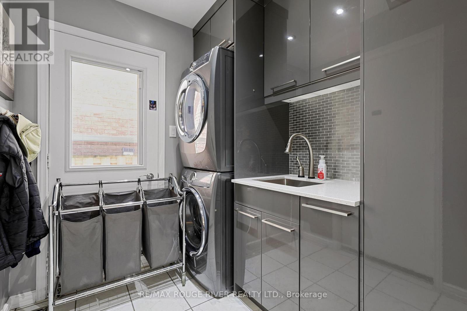 Main Floor Laundry Room with Side Entrance - 11 Canmore Boulevard, Toronto, ON - Indoor Photo Showing Laundry Room