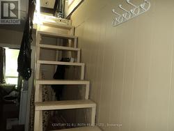 Narrow stairs to upper loft area - 