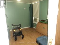 Primary bedroom, adjoining living room upper floor - 