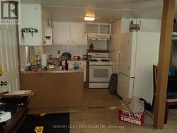 View of Kitchen, right inside lower main entry - 