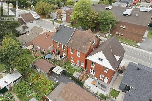 Red brick exterior with white trim - 128 Hess Street N, Hamilton, ON - Outdoor With View