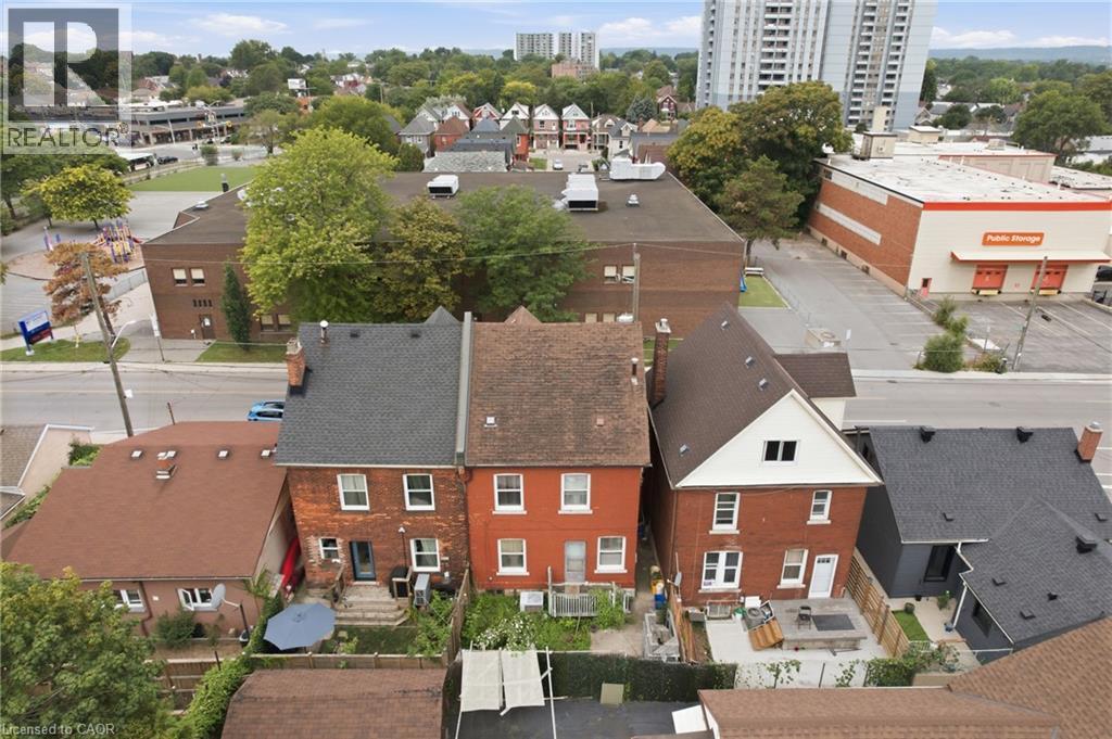 Brick exterior with multiple windows - 128 Hess Street N, Hamilton, ON - Outdoor