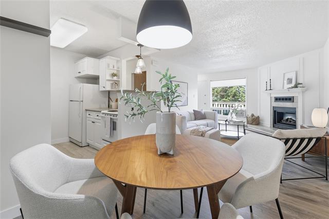 8-700 Blantyre Ave, Winnipeg, MB - Indoor Photo Showing Dining Room With Fireplace