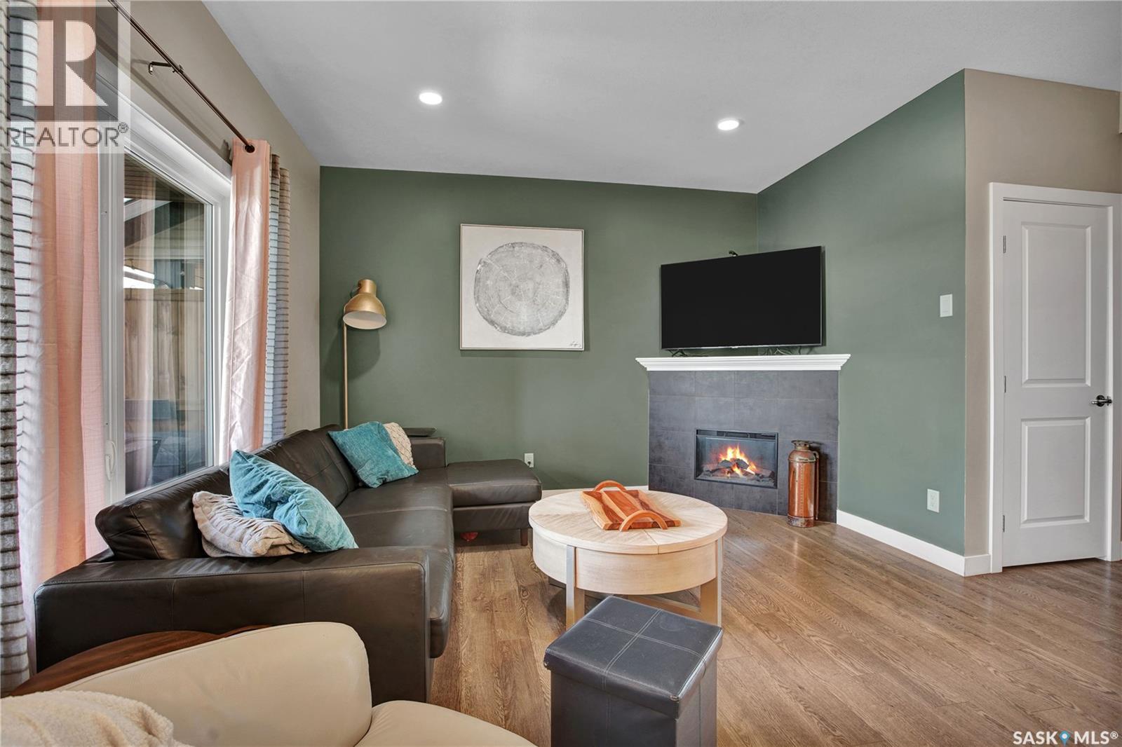 539 Maple Crescent, Warman, SK - Indoor Photo Showing Living Room With Fireplace