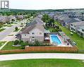 Expansive backyard with a large inground pool, a private patio, and two covered pergolas - 167 Westcliff Way, Cambridge, ON  - Outdoor With View 
