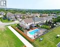 Rear exterior featuring a swimming pool, wood-decked patio, and fenced backyard - 167 Westcliff Way, Cambridge, ON  - Outdoor With View 