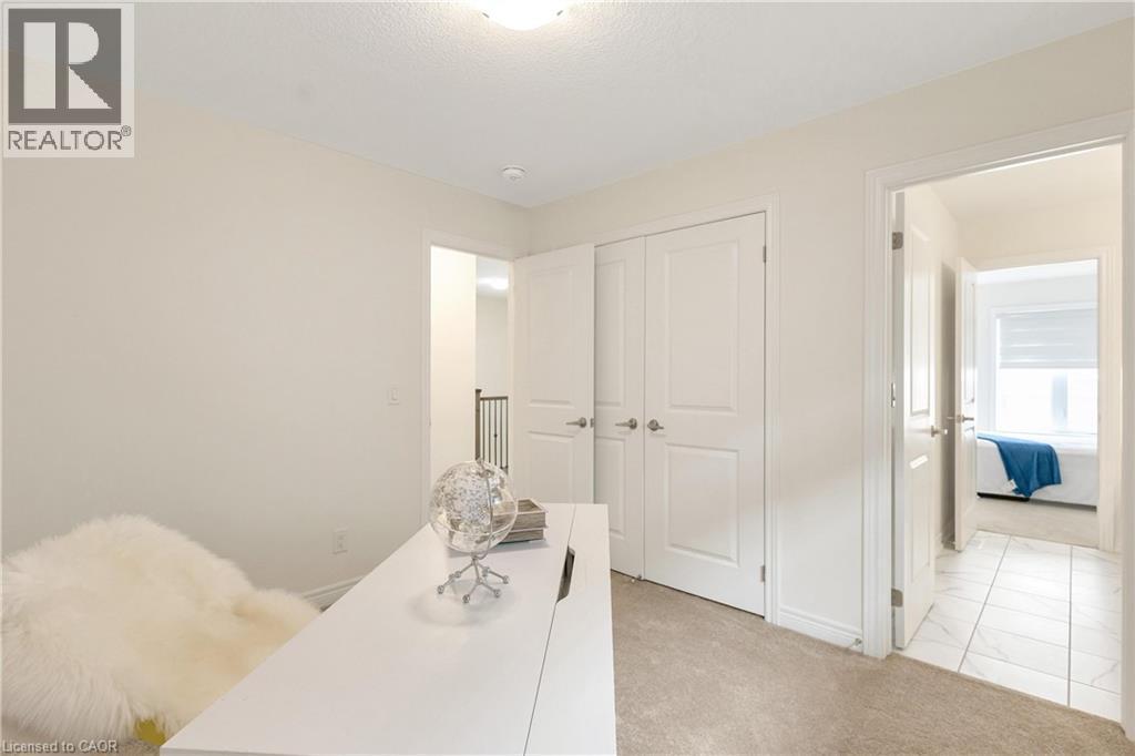 Neutral wall paint, plush carpet flooring, recessed lighting, white panel doors, and tile flooring - 285 Broadacre Drive, Kitchener, ON - Indoor