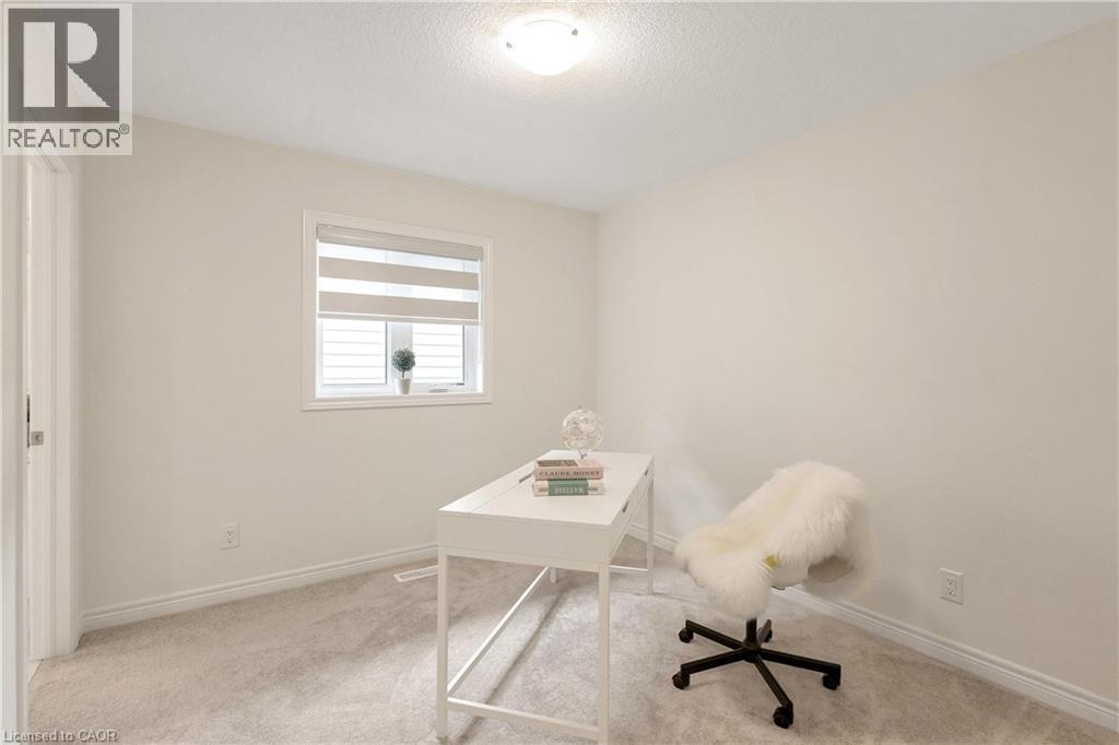 Recessed window with horizontal blinds, overhead ceiling light fixture, and plush carpet flooring - 285 Broadacre Drive, Kitchener, ON - Indoor Photo Showing Office