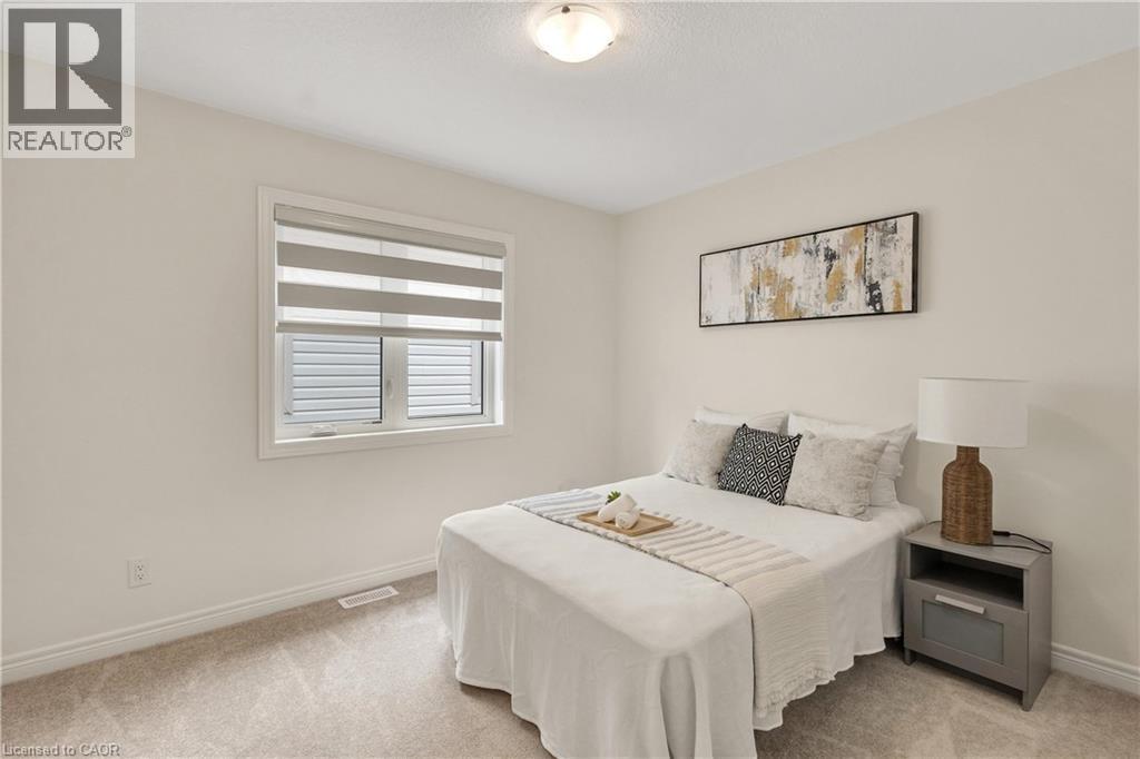 Carpeted flooring, neutral wall tones, recessed ceiling light fixture, window with layered shades, and white trim - 285 Broadacre Drive, Kitchener, ON - Indoor Photo Showing Bedroom
