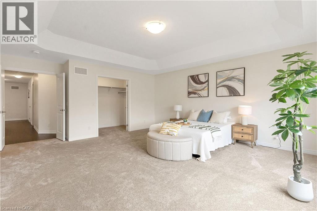 Recessed ceiling with central lighting, neutral carpet flooring, and open closet space - 285 Broadacre Drive, Kitchener, ON - Indoor Photo Showing Bedroom