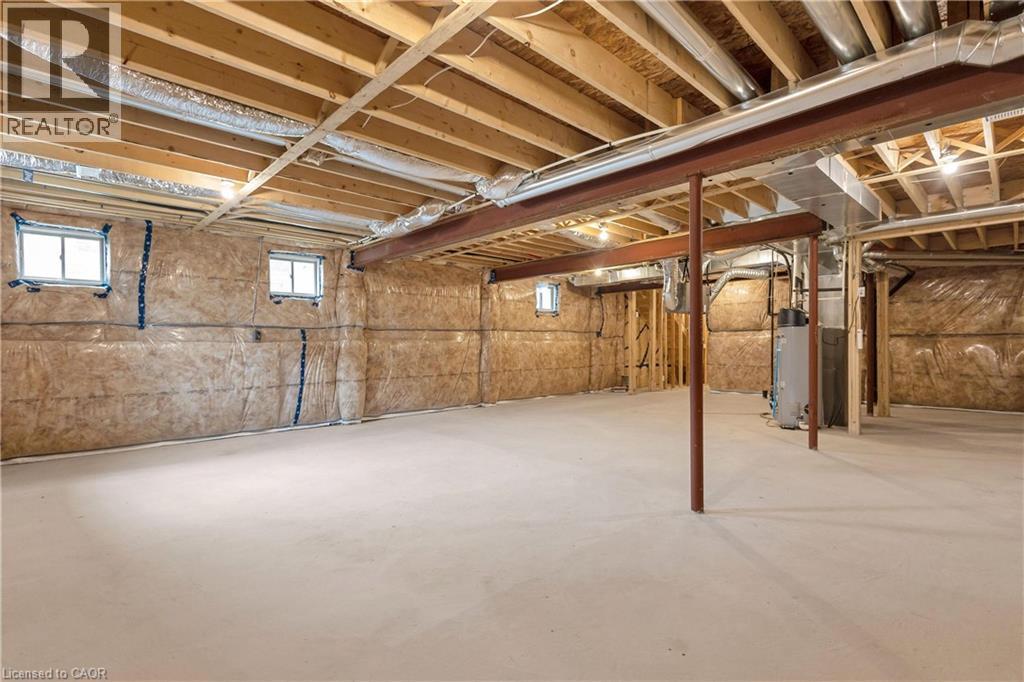 Unfinished basement featuring exposed wood joists, steel support beams, and insulated walls - 285 Broadacre Drive, Kitchener, ON - Indoor Photo Showing Basement