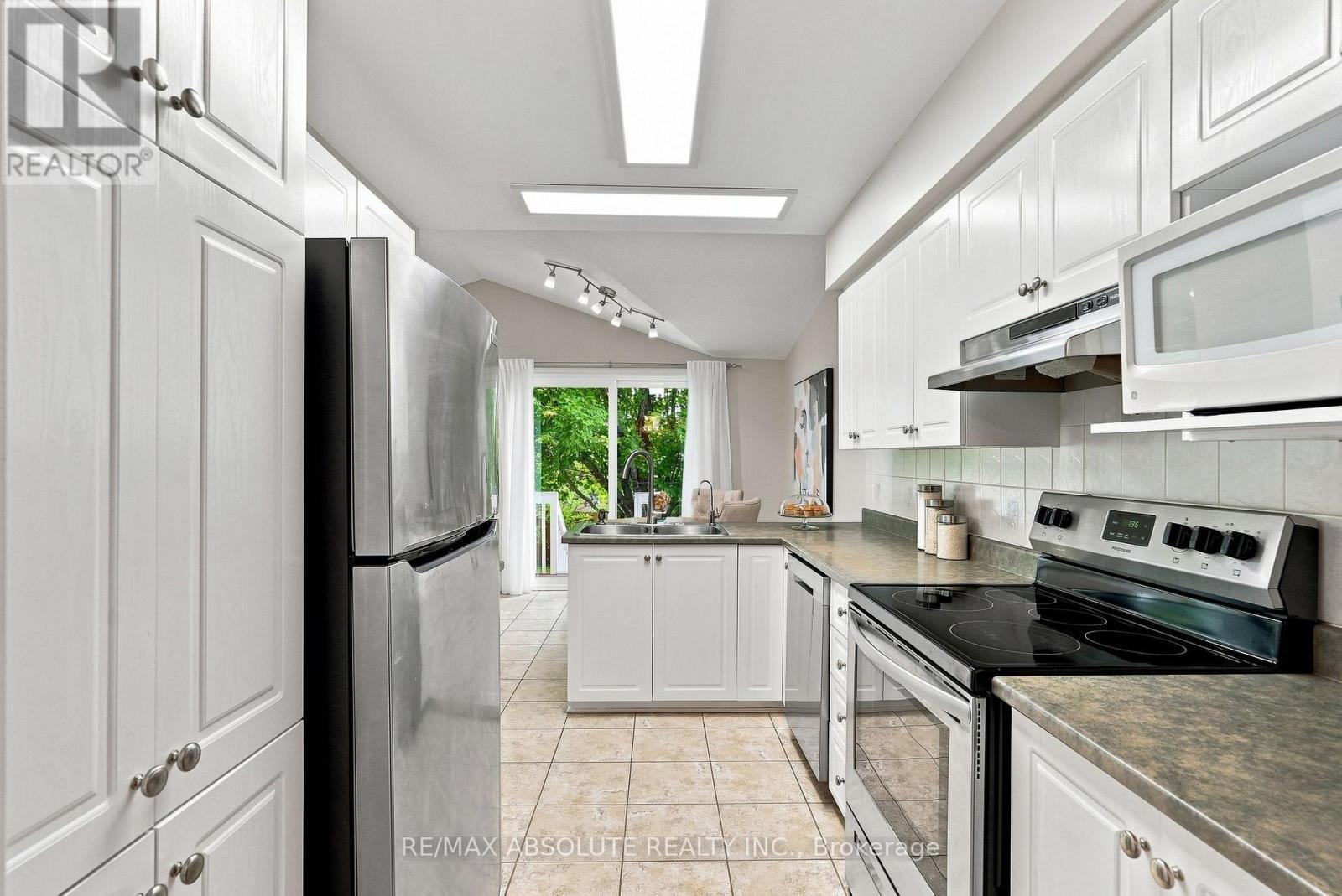 26 Milner Downs Crescent, Ottawa, ON - Indoor Photo Showing Kitchen With Double Sink