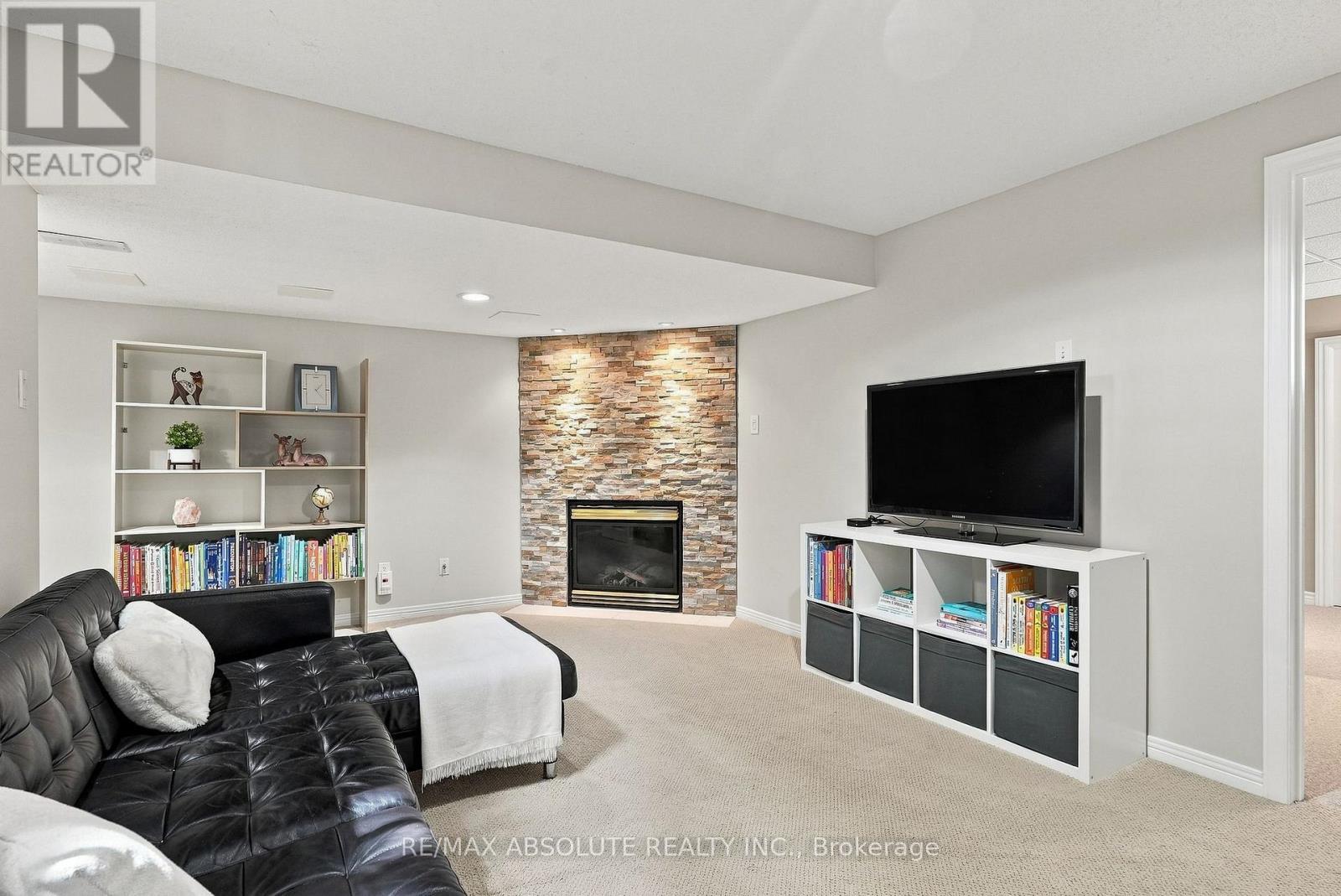 26 Milner Downs Crescent, Ottawa, ON - Indoor Photo Showing Living Room With Fireplace