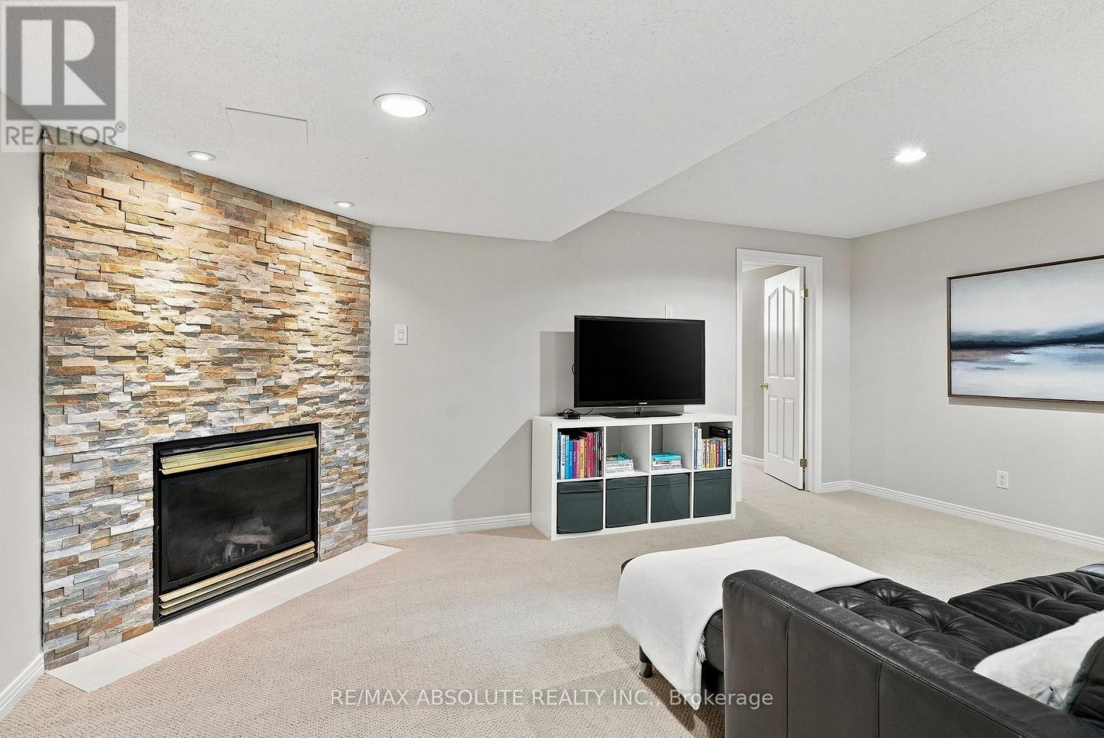 26 Milner Downs Crescent, Ottawa, ON - Indoor Photo Showing Living Room With Fireplace