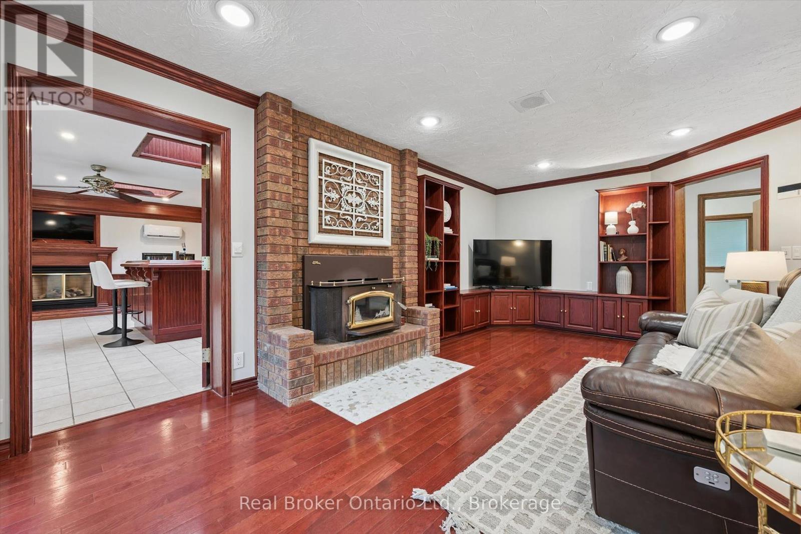 32 Sunset Drive, Woolwich, ON - Indoor Photo Showing Living Room With Fireplace