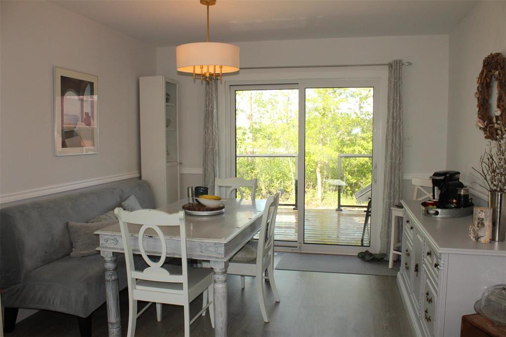 The dining room can accommodate a large table and has plenty of room for a china cabinet or buffet hutch as seen. - 7 Dalvik Road, Gimli Rm, MB - Indoor Photo Showing Dining Room