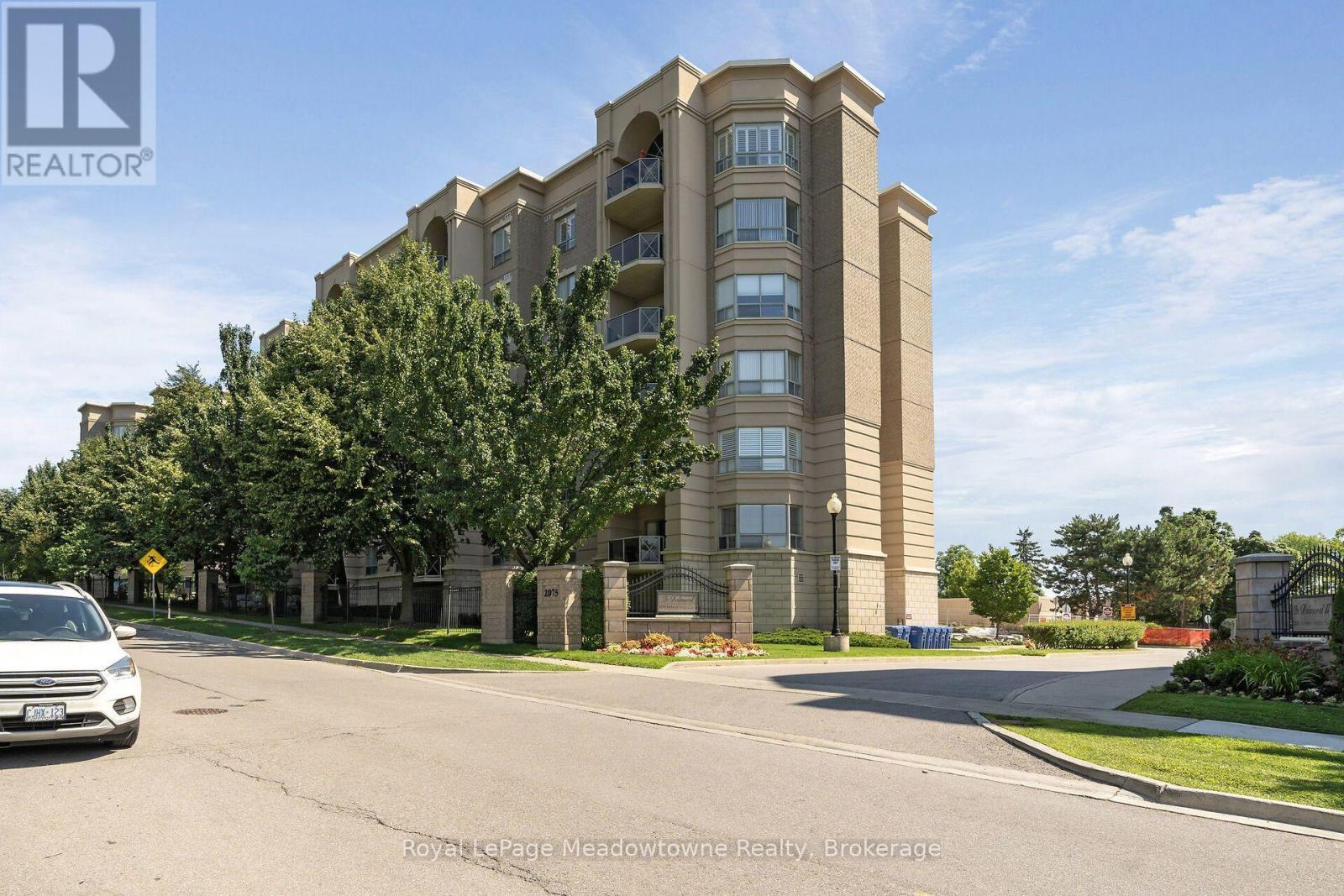 210 - 2075 Amherst Heights Drive, Burlington (Brant Hills), ON - Outdoor With Balcony With Facade