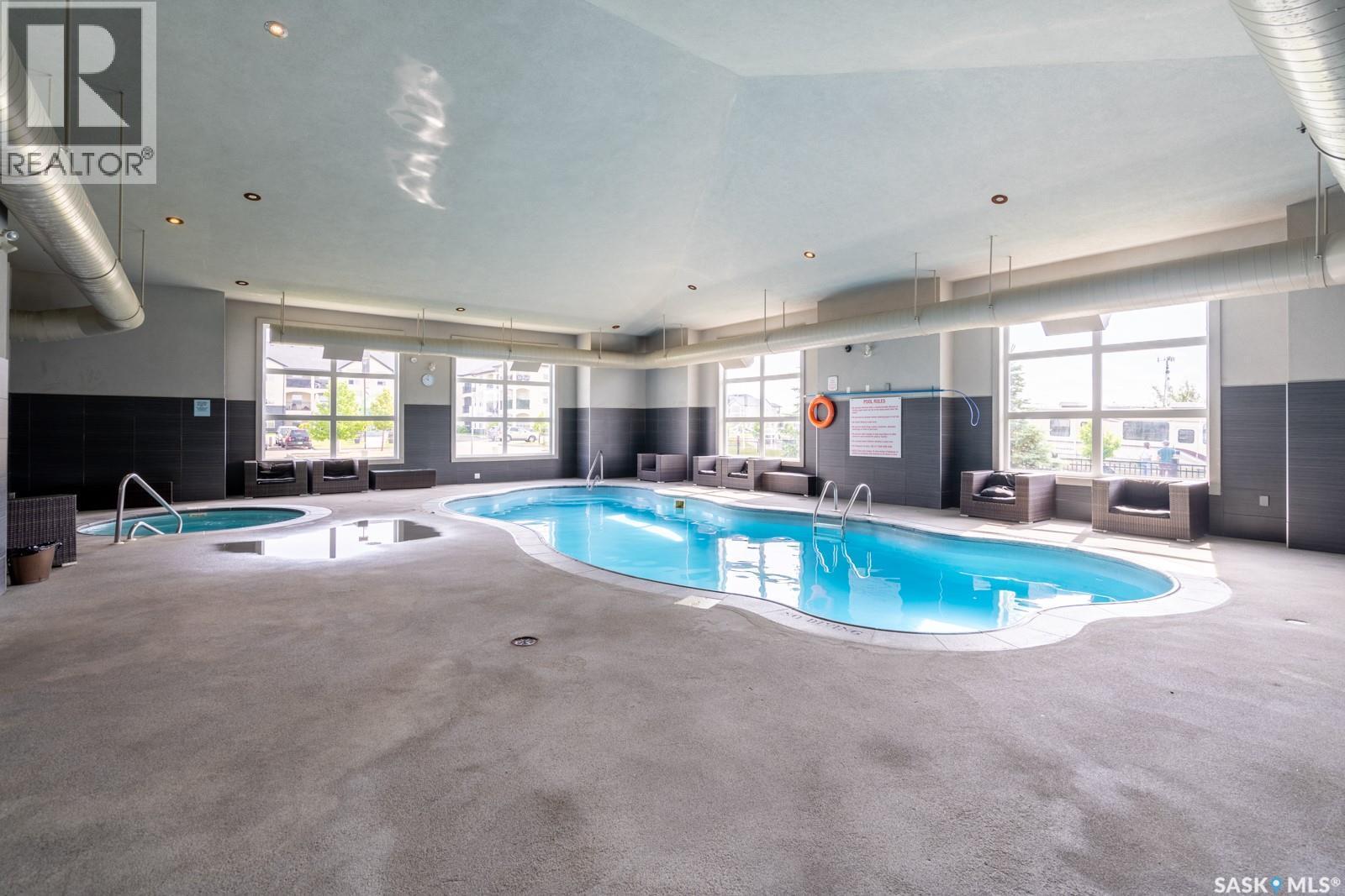 102 1610 Dakota Drive, Regina, SK - Indoor Photo Showing Other Room With In Ground Pool