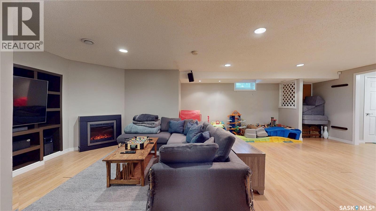 3107 Andreychuk Place E, Regina, SK - Indoor Photo Showing Basement With Fireplace
