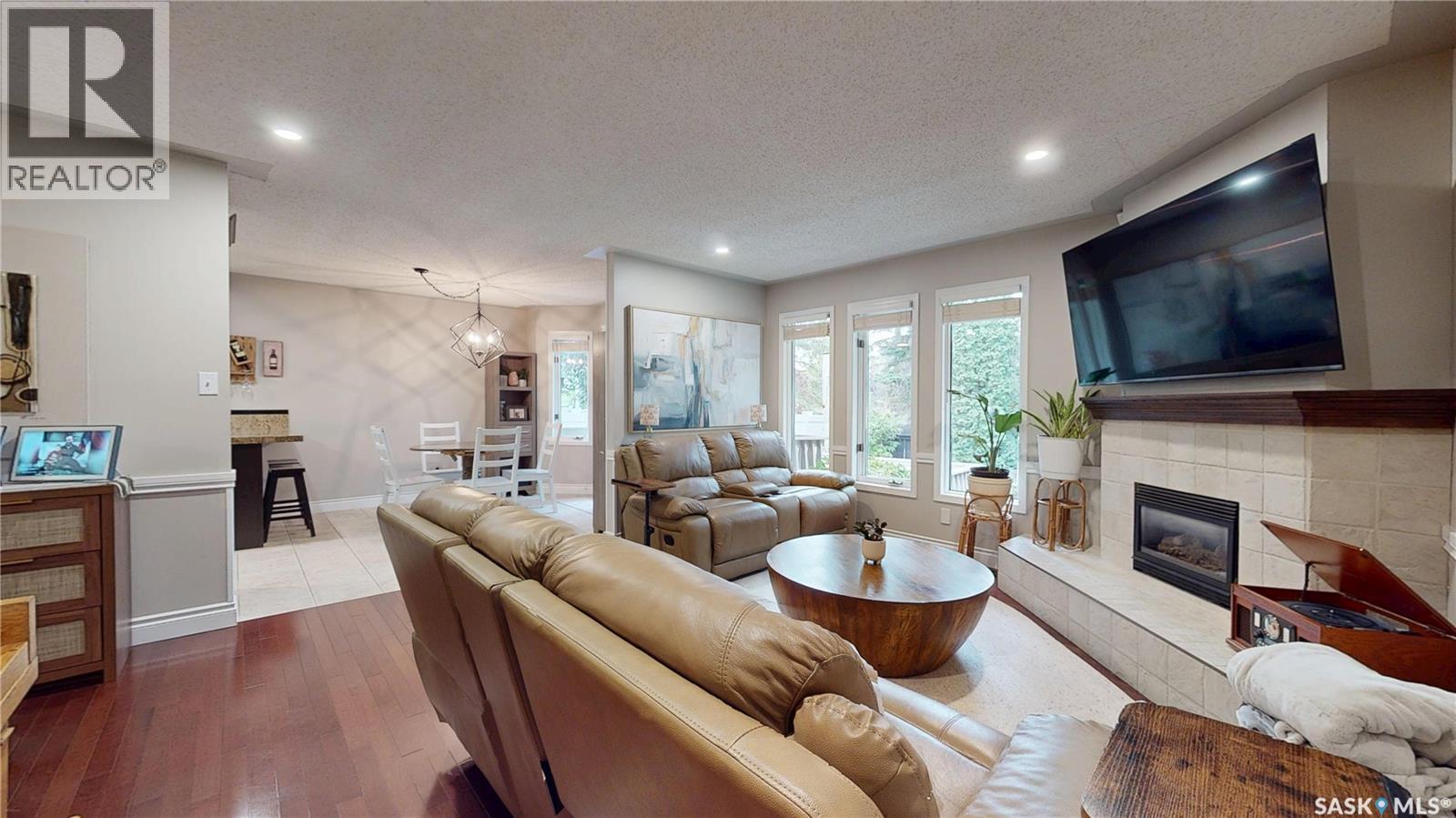 3107 Andreychuk Place E, Regina, SK - Indoor Photo Showing Living Room With Fireplace
