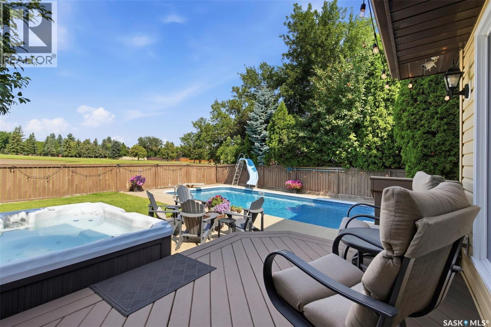 306 Whitewood Road, Saskatoon, SK - Outdoor With In Ground Pool With Deck Patio Veranda