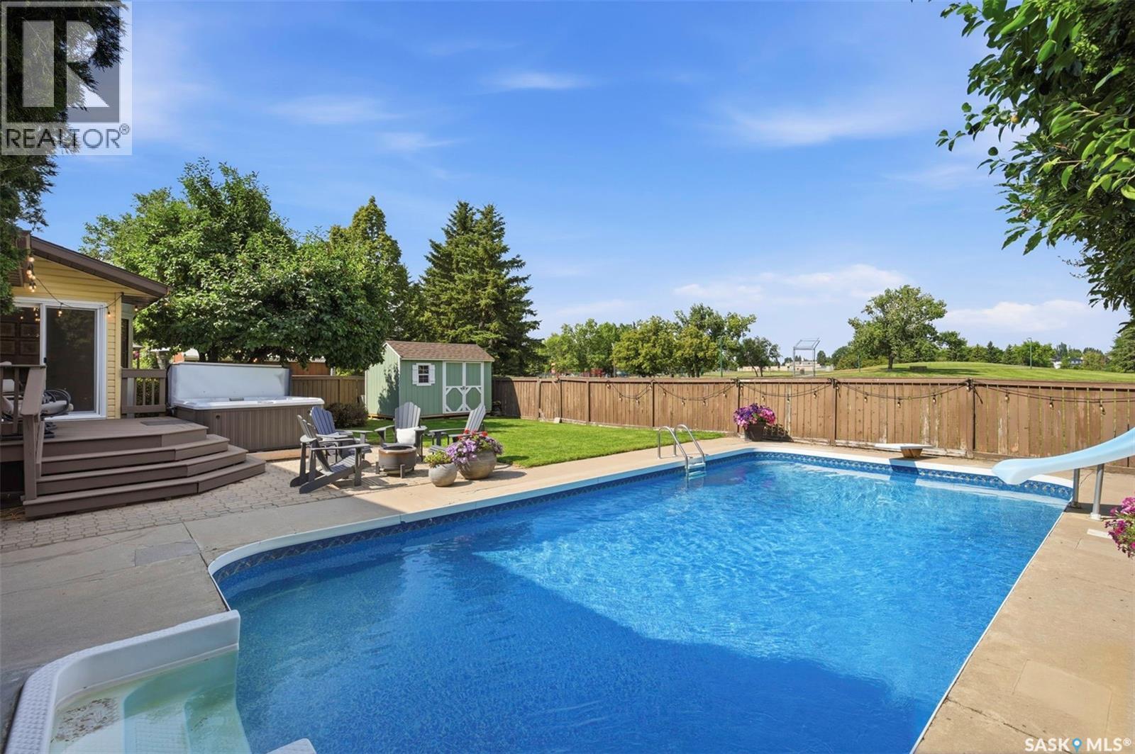 306 Whitewood Road, Saskatoon, SK - Outdoor With In Ground Pool With Backyard