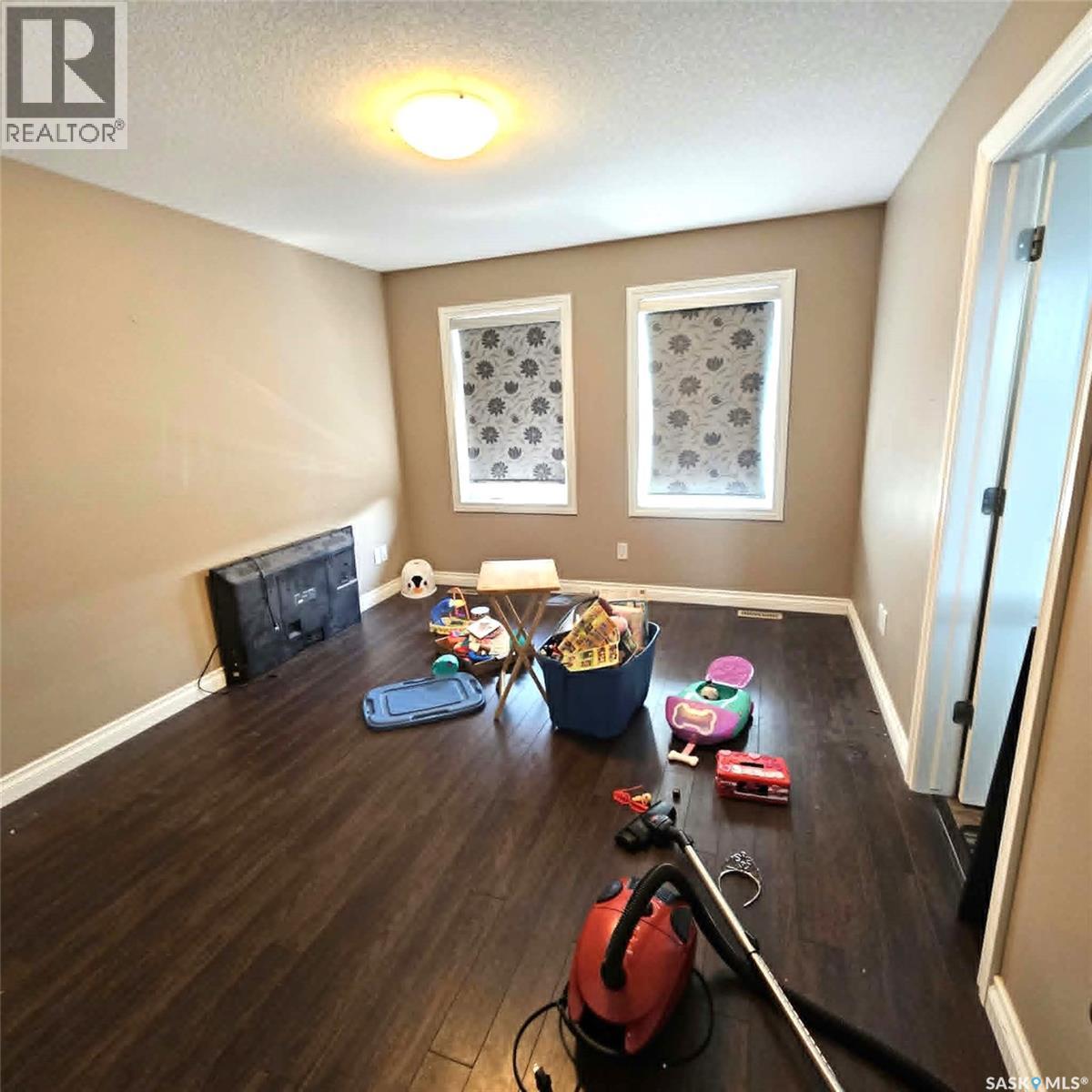 5008 Aerial Crescent, Regina, SK - Indoor With Fireplace