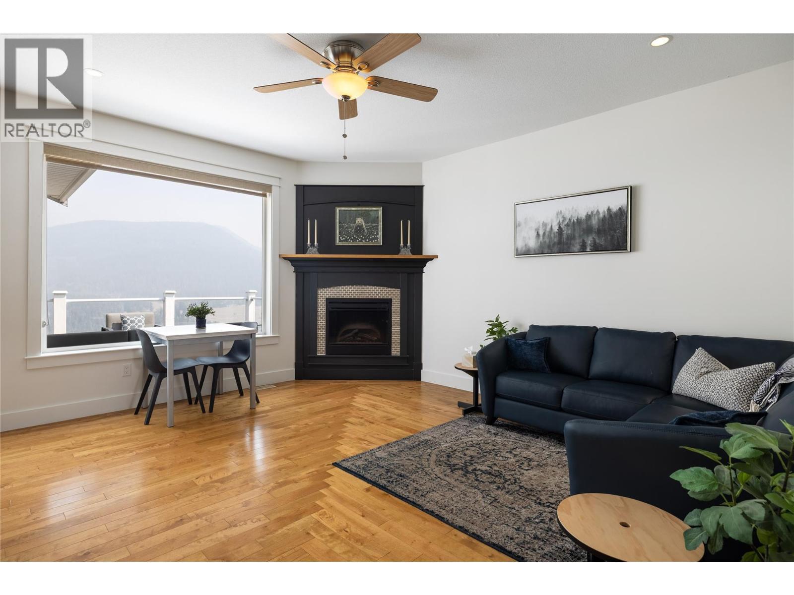 Relax and enjoy life. - 7261 Silver Ridge Drive, Vernon, BC - Indoor Photo Showing Living Room With Fireplace