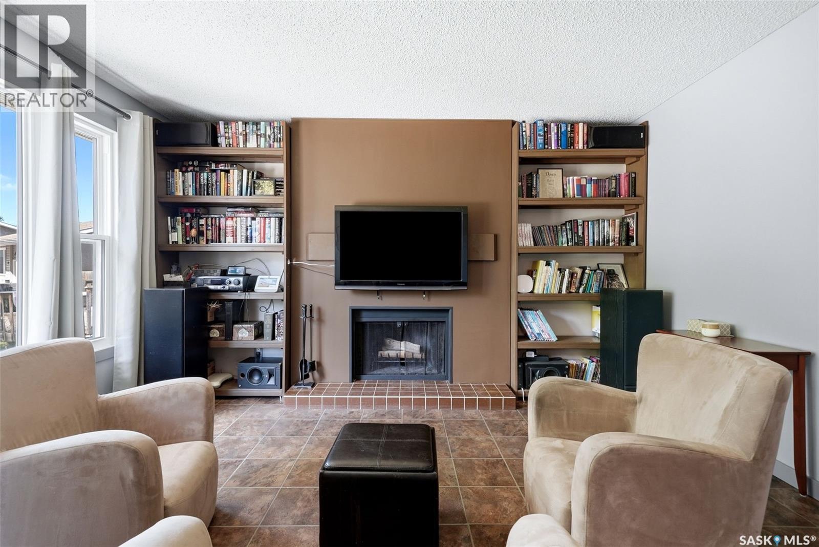 51 Martinac Crescent, Regina, SK - Indoor With Fireplace