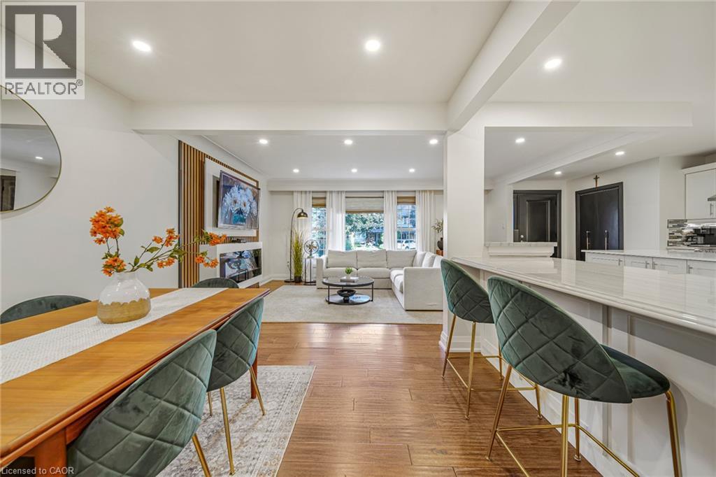 Wood-finish flooring, recessed lighting, and a kitchen island with a light-toned countertop - 24 Garvey Crescent, Hamilton, ON - Indoor
